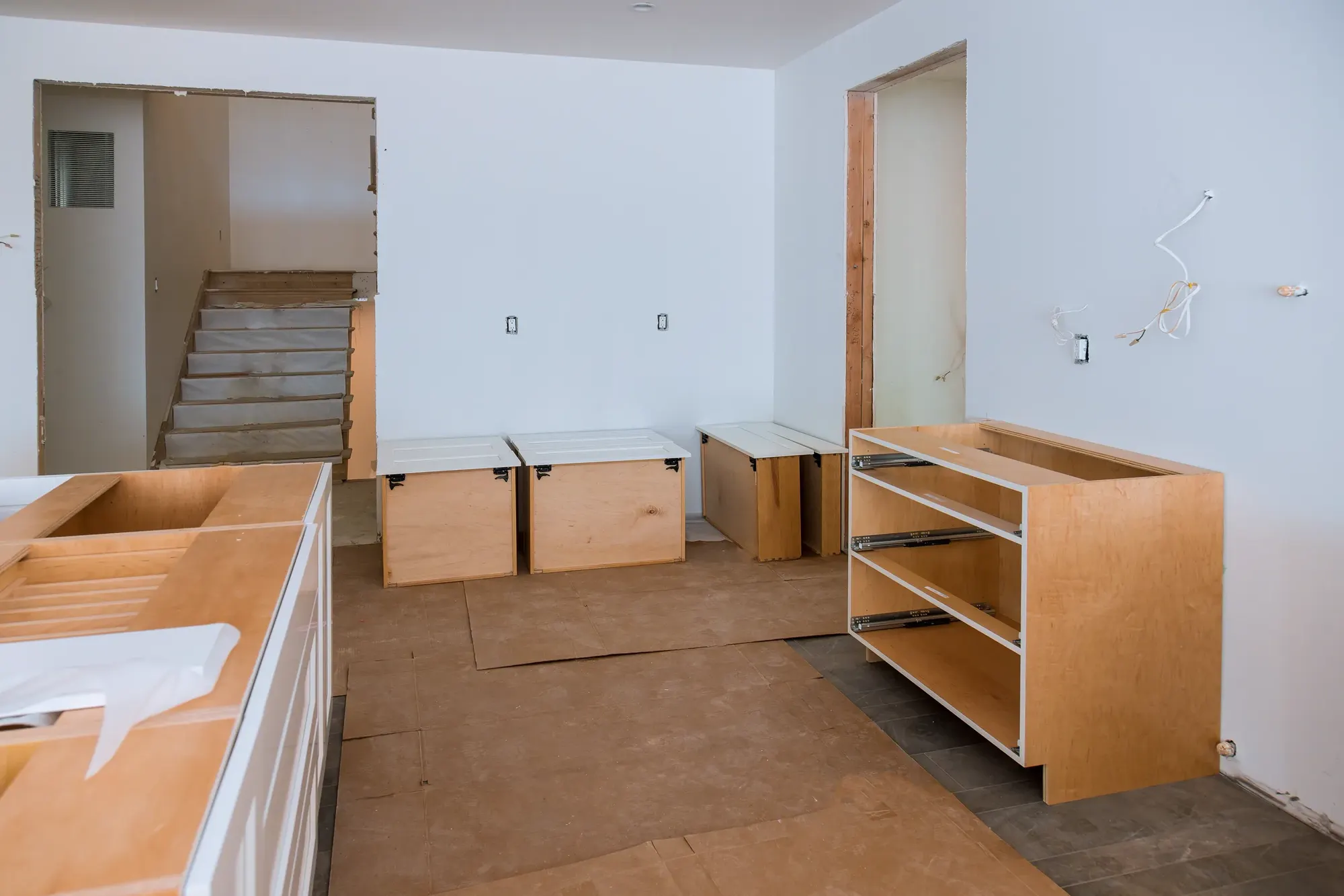 Unfinished kitchen cabinets during an interior renovation